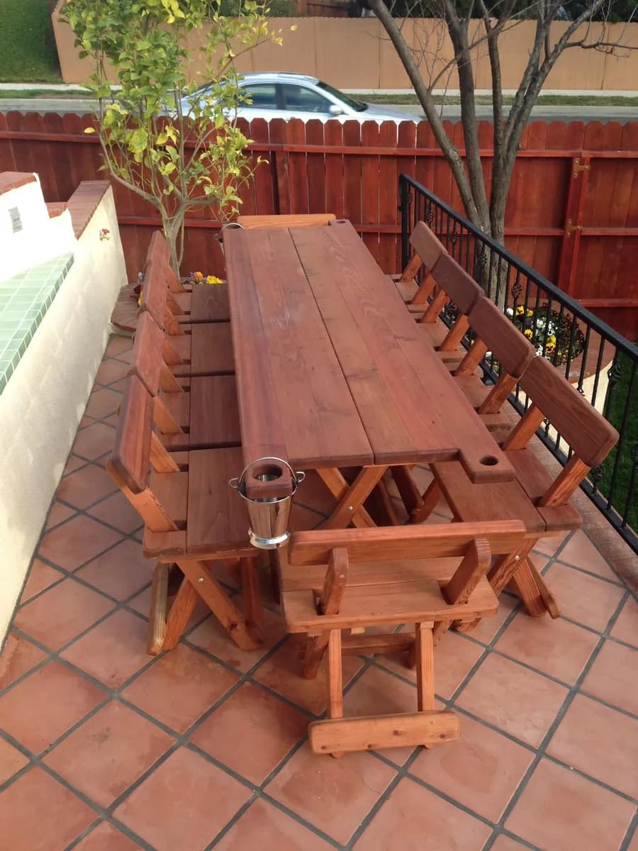 Long Michael Frazier redwood table fitted on a narrow patio